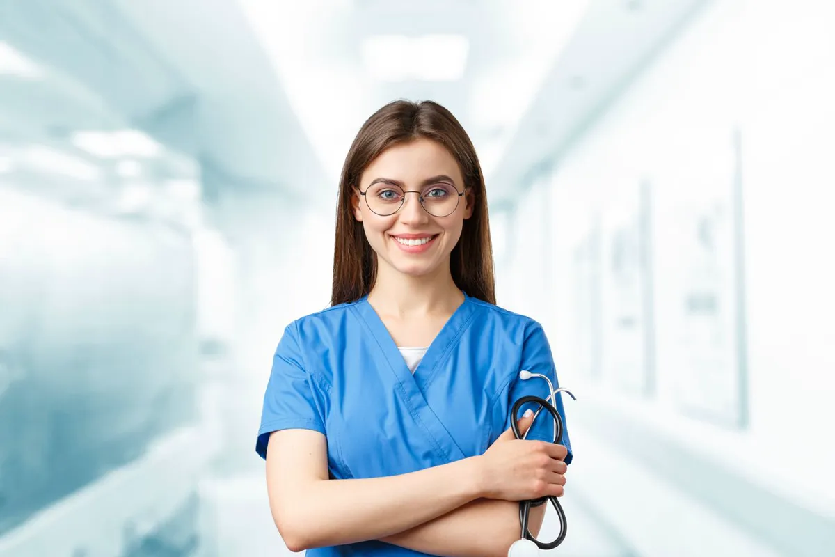 A nurse standing in a hospital corridor