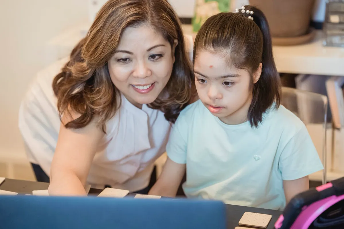 A teacher working through a task one-to-one with a pupil