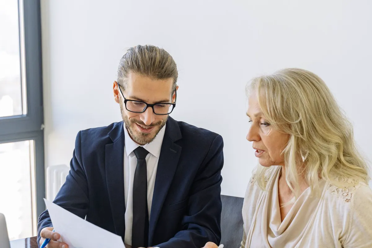 An adviser reviewing documents with a client
